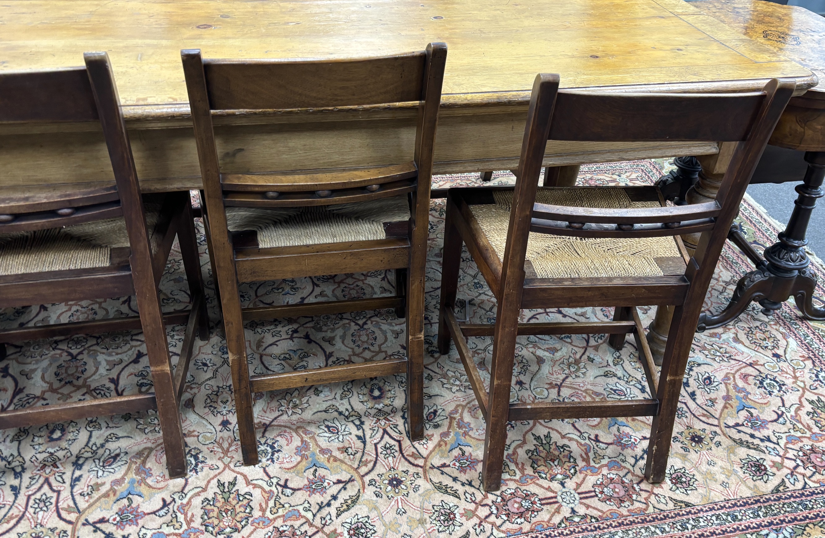 A set of nine early 19th century Provincial mahogany rush seat dining chairs, width 47cm, depth 38cm, height 86cm